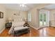 Bedroom with hardwood floors and bright sunny windows at 3514 Golfview Blvd, Orlando, FL 32804