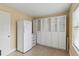 Bright pantry with white cabinets, drawers, and refrigerator at 3514 Golfview Blvd, Orlando, FL 32804