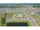 The aerial view showcases the community's pool, clubhouse, and surrounding homes at 4307 Pebbles Throw Dr, Kissimmee, FL 34746