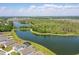 Scenic aerial view shows the community's serene lake and walking trails at 4307 Pebbles Throw Dr, Kissimmee, FL 34746
