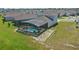 Birds eye view of the back of the property showing the screened in pool and back yard at 4307 Pebbles Throw Dr, Kissimmee, FL 34746