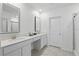 Bright bathroom features a double sink vanity with neutral-colored walls and tile flooring at 4307 Pebbles Throw Dr, Kissimmee, FL 34746