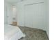 Bedroom features a large closet with double doors and neutral carpeting at 4307 Pebbles Throw Dr, Kissimmee, FL 34746