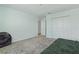 Bedroom featuring neutral walls, plush carpet, and a spacious closet at 4307 Pebbles Throw Dr, Kissimmee, FL 34746