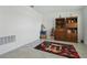 Bonus room featuring a decorative rug, built-in bookcases, and a festive Christmas tree at 4307 Pebbles Throw Dr, Kissimmee, FL 34746