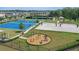 A view of the community amenities including basketball courts, tennis courts, sand volleyball and an outdoor fitness center at 4307 Pebbles Throw Dr, Kissimmee, FL 34746