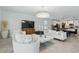 Bright living room featuring stylish decor, comfortable seating, and an open floor plan at 4307 Pebbles Throw Dr, Kissimmee, FL 34746