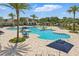 Enjoy the refreshing community pool with beautiful landscaping and lounge chairs at 4307 Pebbles Throw Dr, Kissimmee, FL 34746
