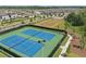 View of the community's well-maintained tennis courts, perfect for sports and recreation in this lovely neighborhood at 4307 Pebbles Throw Dr, Kissimmee, FL 34746