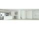 Open-concept living space with gray kitchen, connecting living room, and staircase at 4787 Guinep Ln, Kissimmee, FL 34758