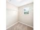 Walk-in closet equipped with wire shelving and a window offering natural light and ventilation at 5004 Ashford Falls Ln, Oviedo, FL 32765