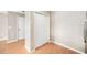 Bright hallway with hardwood floors, a closet, and neutral paint, and doorway to the left at 5004 Ashford Falls Ln, Oviedo, FL 32765