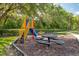 Community playground, complete with slide, picnic table and merry-go-round is fun for all ages at 5004 Ashford Falls Ln, Oviedo, FL 32765