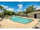 Community pool with plenty of seating and mature landscaping, for a relaxing and fun day at 5004 Ashford Falls Ln, Oviedo, FL 32765