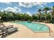 Enjoy the Florida lifestyle at this pool surrounded by palm trees and lounge chairs at 5004 Ashford Falls Ln, Oviedo, FL 32765
