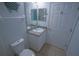 Bathroom with a vanity, toilet, and neutral color tile at 5300 S Atlantic Ave # 4-302, New Smyrna Beach, FL 32169