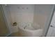 Relaxing soaking tub with jets in neutral-toned bathroom at 5300 S Atlantic Ave # 4-302, New Smyrna Beach, FL 32169