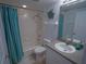 Bathroom with a tub and shower combination, neutral color tile, and modern fixtures at 5300 S Atlantic Ave # 4-302, New Smyrna Beach, FL 32169