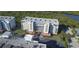An aerial shot captures this condominium community with its lush landscaping and ample parking at 5300 S Atlantic Ave # 4-302, New Smyrna Beach, FL 32169