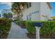 Attractive exterior view of Recreational Building II featuring lush landscaping and convenient mailbox at 5300 S Atlantic Ave # 4-302, New Smyrna Beach, FL 32169