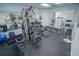 Well-equipped gym with modern exercise machines, weights, and mirrored walls for fitness enthusiasts at 5300 S Atlantic Ave # 4-302, New Smyrna Beach, FL 32169
