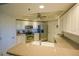 Bright kitchen with stainless steel appliances, tile backsplash, and stone countertops at 5300 S Atlantic Ave # 4-302, New Smyrna Beach, FL 32169