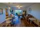 Inviting living room with sliding glass doors to balcony and dining area at 5300 S Atlantic Ave # 4-302, New Smyrna Beach, FL 32169