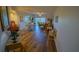 Open concept living room and dining area with wood floors and stylish decor at 5300 S Atlantic Ave # 4-302, New Smyrna Beach, FL 32169
