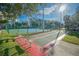 Community shuffleboard courts and tennis courts offer recreational activities for residents at 5300 S Atlantic Ave # 4-302, New Smyrna Beach, FL 32169