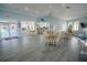 Bright recreation room featuring tile floors, tables and chairs, and views of the pool area at 5300 S Atlantic Ave # 4-302, New Smyrna Beach, FL 32169