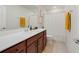 Bathroom with vanity, neutral walls, tile floors and shower/bath combo at 5660 Oak Knoll Dr, St Cloud, FL 34771