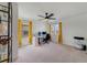 Large home office with built-in shelving, a ceiling fan, and lots of natural light at 5660 Oak Knoll Dr, St Cloud, FL 34771