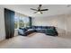 Spacious living room with a comfortable sectional sofa and lots of natural light at 5660 Oak Knoll Dr, St Cloud, FL 34771