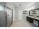 Bathroom featuring a glass-enclosed shower, vanity with sink, and ample space at 5829 Valentino Way, Lakeland, FL 33812
