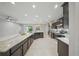 Expansive kitchen with a large island, stainless steel appliances, and open flow to the living area at 5829 Valentino Way, Lakeland, FL 33812