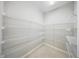 Walk-in pantry with wire shelving provides ample storage space at 5829 Valentino Way, Lakeland, FL 33812