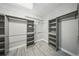 Walk-in closet featuring custom shelving and ample storage space at 5829 Valentino Way, Lakeland, FL 33812