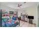 This bedroom features a bunk bed, wood-look flooring, and a ceiling fan at 605 Ensenada Dr, Orlando, FL 32825