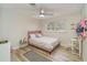 Bedroom featuring a pink bed, luxury vinyl plank flooring, a window, and neutral walls at 605 Ensenada Dr, Orlando, FL 32825