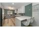 Bright kitchen features quartz countertops, stylish backsplash, and stainless steel appliances at 605 Ensenada Dr, Orlando, FL 32825