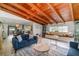 Bright living room showcasing wood-beam ceilings, and an open layout with inviting natural light at 605 Ensenada Dr, Orlando, FL 32825