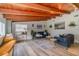 Cozy living room with wood ceiling beams, modern furniture, and stylish decor at 605 Ensenada Dr, Orlando, FL 32825