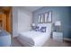 Bedroom features white furniture, soft carpet, and natural light at 7595 Sunny Dreams Ln, Kissimmee, FL 34747