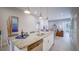 The gourmet kitchen opens into a spacious living area with access to the outdoor patio at 7595 Sunny Dreams Ln, Kissimmee, FL 34747