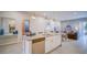 A gourmet kitchen seamlessly flows into the dining and living room area at 7595 Sunny Dreams Ln, Kissimmee, FL 34747