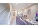 Spacious living area with tile floors, an open floor plan, and lots of natural light at 7595 Sunny Dreams Ln, Kissimmee, FL 34747