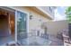 Outdoor patio complete with a dining area and a built-in kitchen with stone accents at 7595 Sunny Dreams Ln, Kissimmee, FL 34747