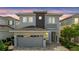 Charming two-story home with a well-manicured lawn and a modern architectural design at 7759 Westland Dr, Kissimmee, FL 34747