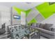 Game room features a foosball table, a comfortable sofa, and a wall-mounted TV for entertainment at 7759 Westland Dr, Kissimmee, FL 34747