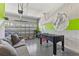 Spacious garage converted to game room with foosball table, basketball decor, and comfortable seating at 7759 Westland Dr, Kissimmee, FL 34747